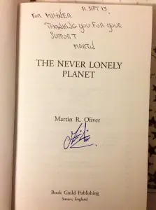 Autographed copy of 'The Never Lonely Planet' by Martin Oliver